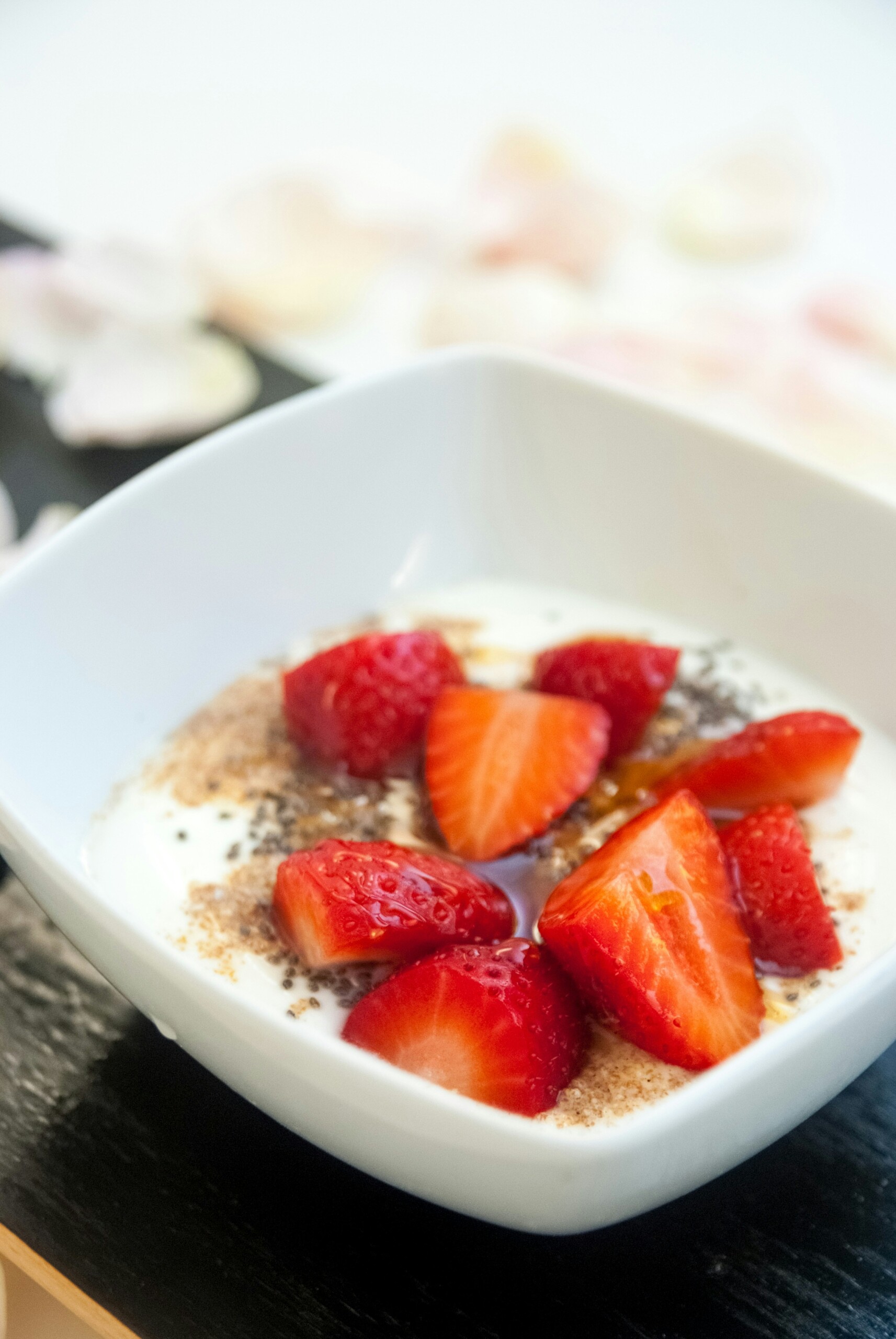 White Bowl with Greek Yogurt and Berries. Chia Seeds sprinkled on top