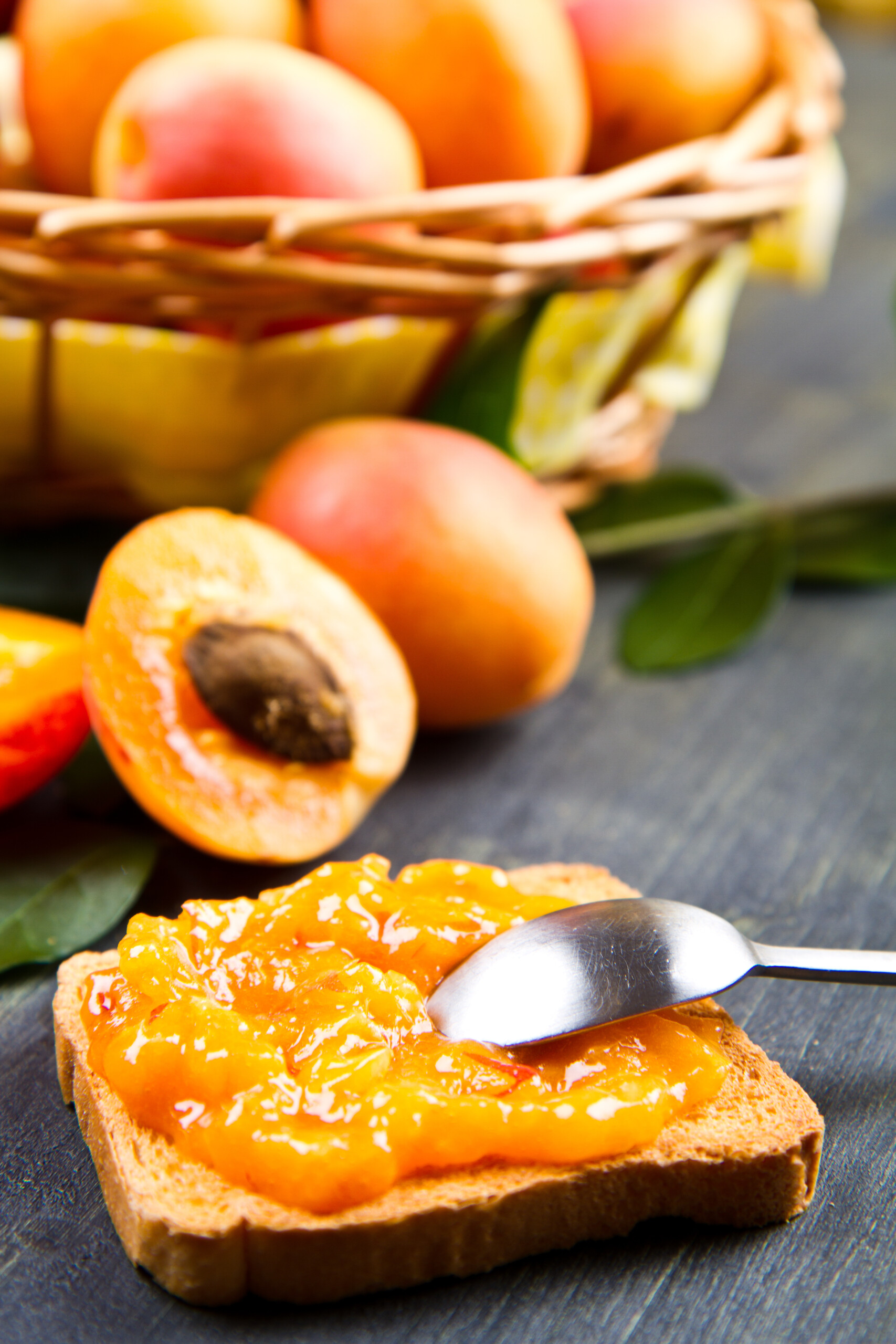 apricot jam on toast with apricots in the background